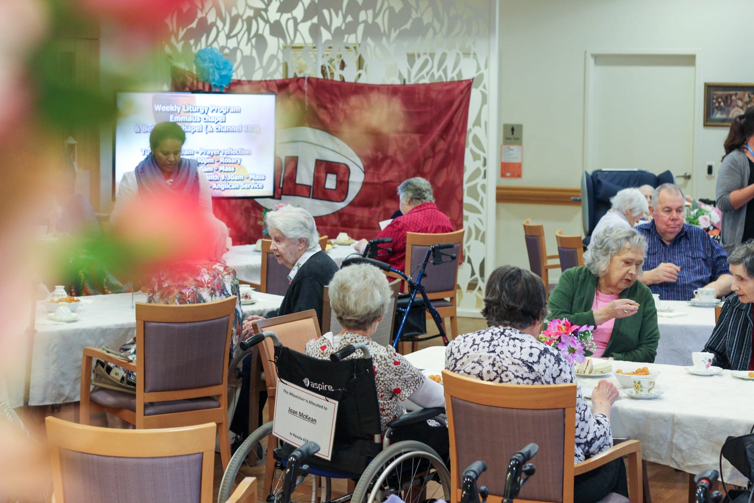 Aged care residents celebrating with Sister Jeanne.