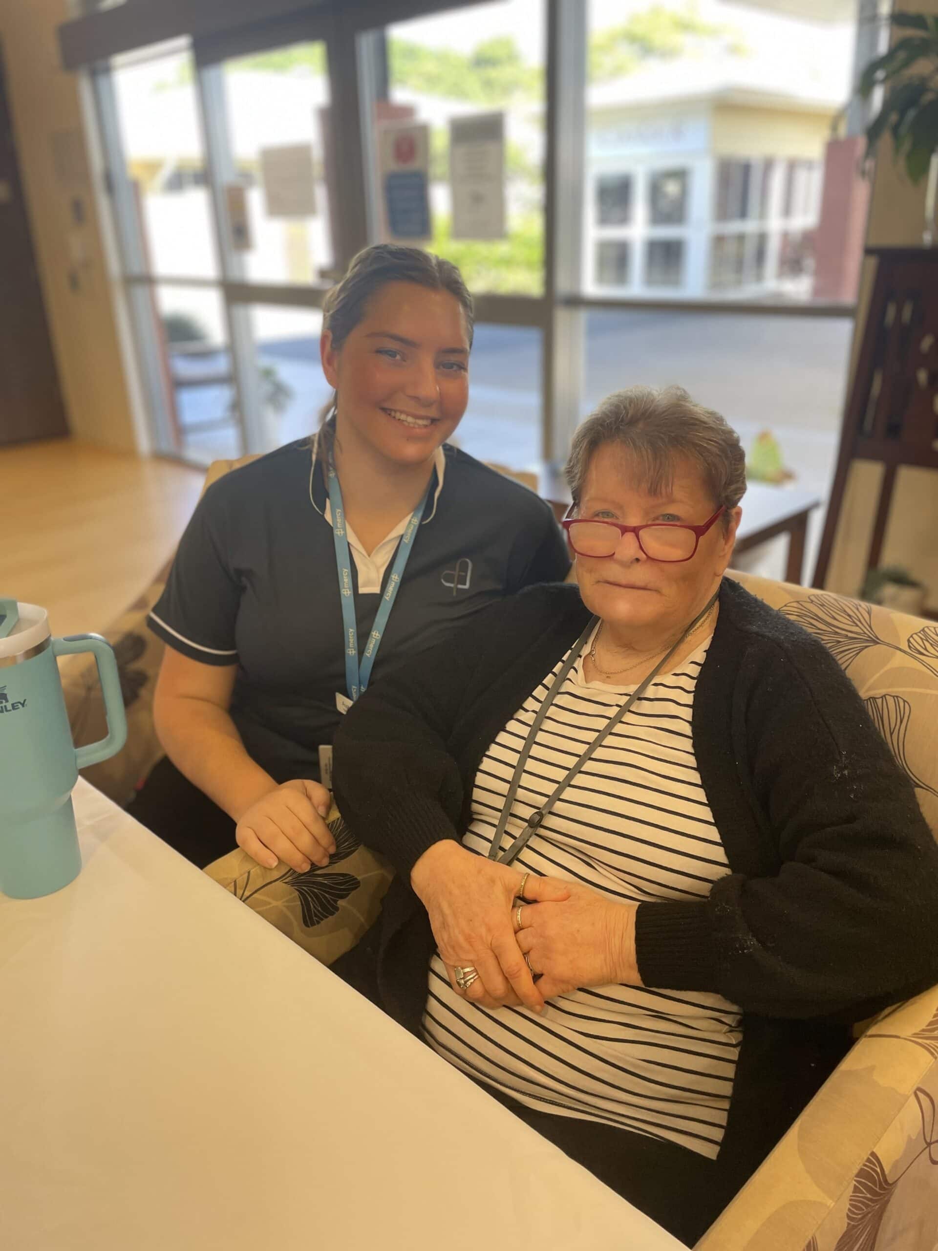 Enrolled Nurse Ava-Rose with resident, Cheryl.