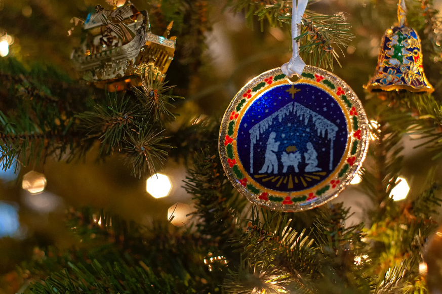 Christmas bauble on tree depicting the nativity