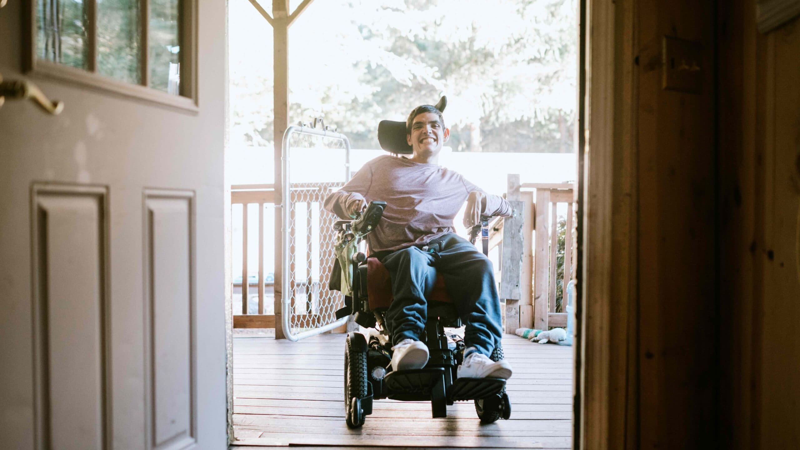 Confident Young Man In Wheelchair At Home