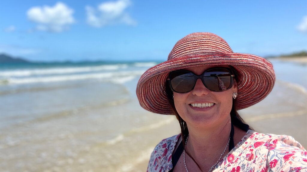 Debbie Everett, Communications Advisor for Mercy Community and author of this blog, takes a smiling selfie at the beach.