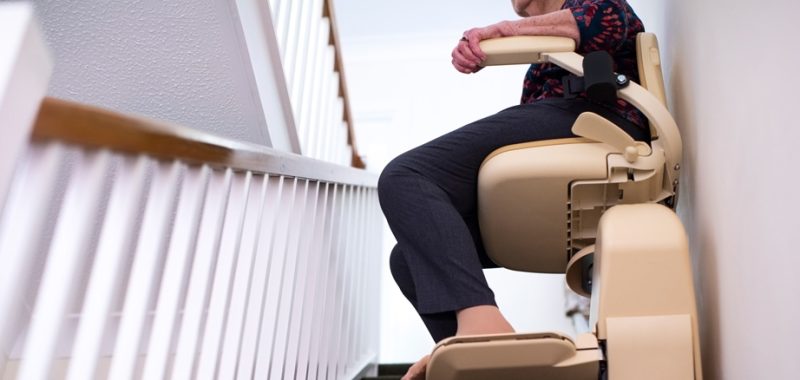 Detail-Of-Senior-Woman-Sitting-On-Stair-Lift-At-Home-To-Help-Mobility-1088937532_800x350